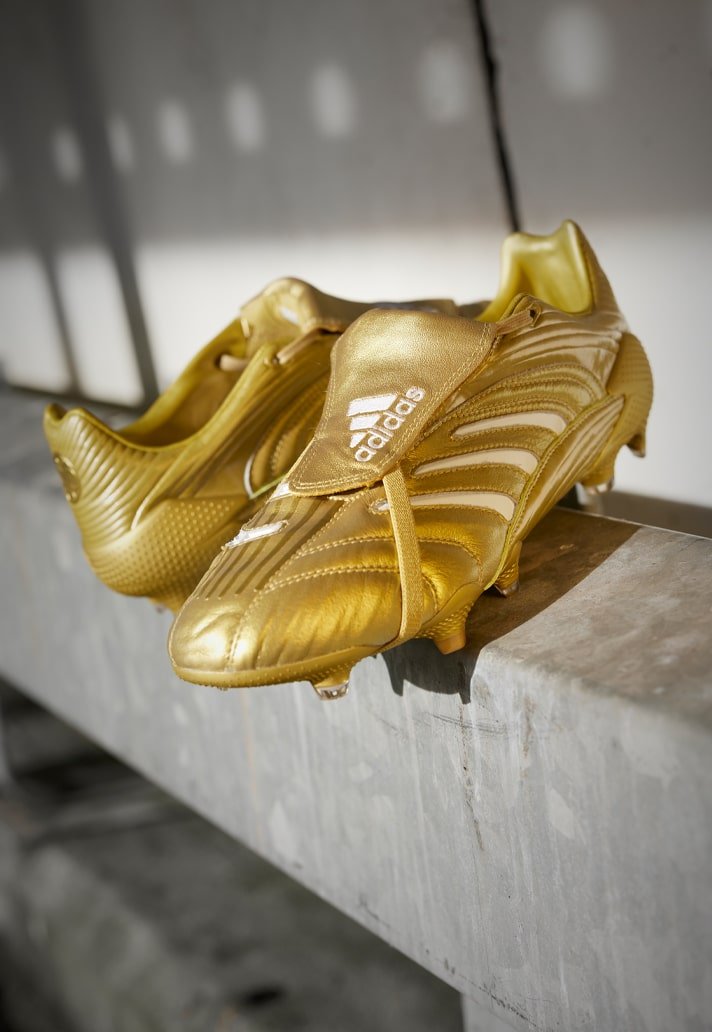 gold and white adidas boots